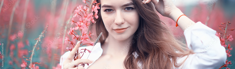 Fototapeta premium pink flowers hairgirl model / beautiful glamorous fashion model in the field nature summer
