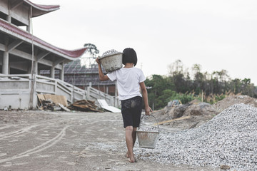 poor little girl working at construction site for world day against child labor concept: