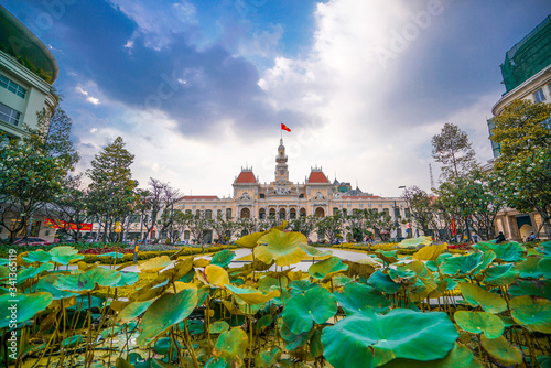 Cityscape view of HoChiMinh City People's Committee and Nguyen Hue Walking Street , Vietnam with blue sky at sunset.