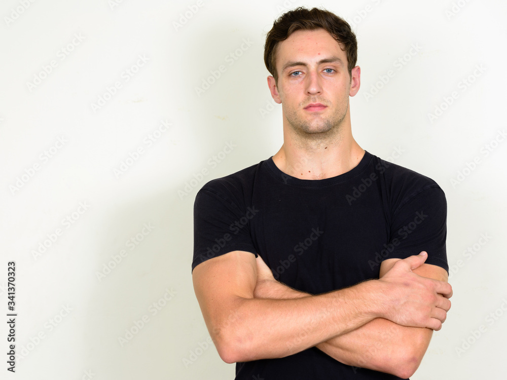 Portrait of young handsome man with arms crossed Portrait of young handsome man with arms crossed
