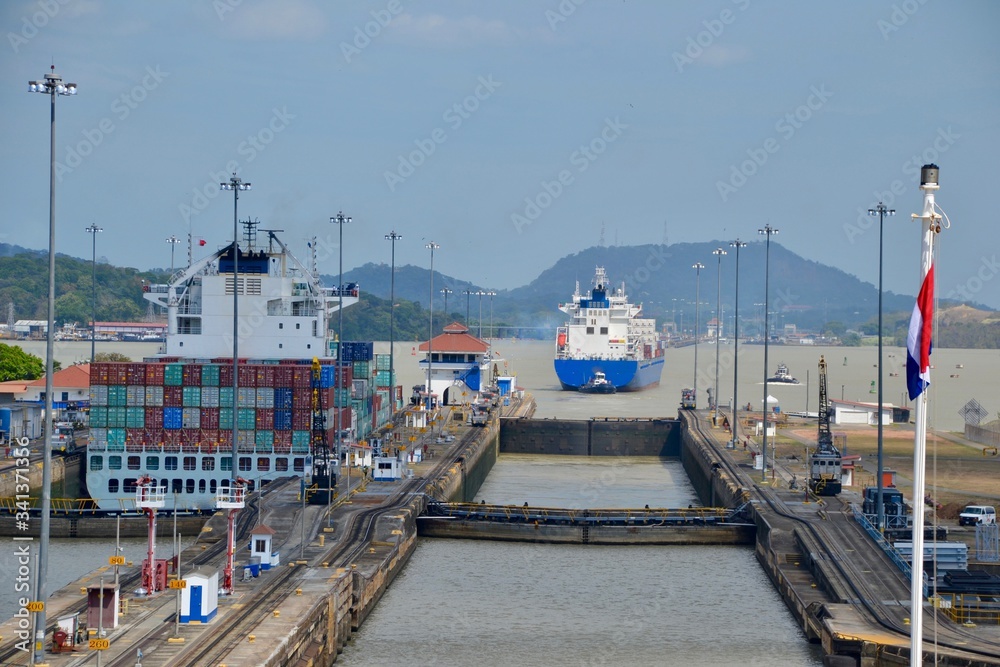 Pedro Miguel locks in the Panama Canal.   You can see the new Pacific lock on the right, and faintly in the distance, the Bridge of the Americas.