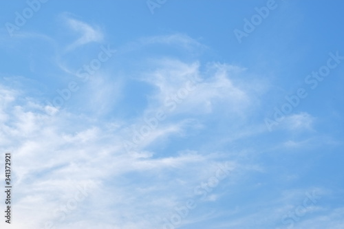 Group of white fluffy clouds and blue sky.
