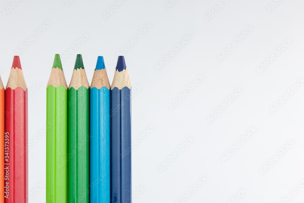 Line of colored pencils isolated on white background Line of colored pencils isolated on white background