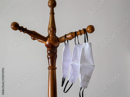 Fabric masks hanging to dry after washing for re-use for corona virus, or covid-19 protection.