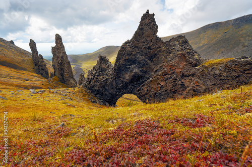 Russia. Kamchatka. Nature Park "Volcanoes of Kamchatka", "Sculpture Gorge".natural arch in the rock, which was formed after a powerful eruption of the volcano. Dyke.
