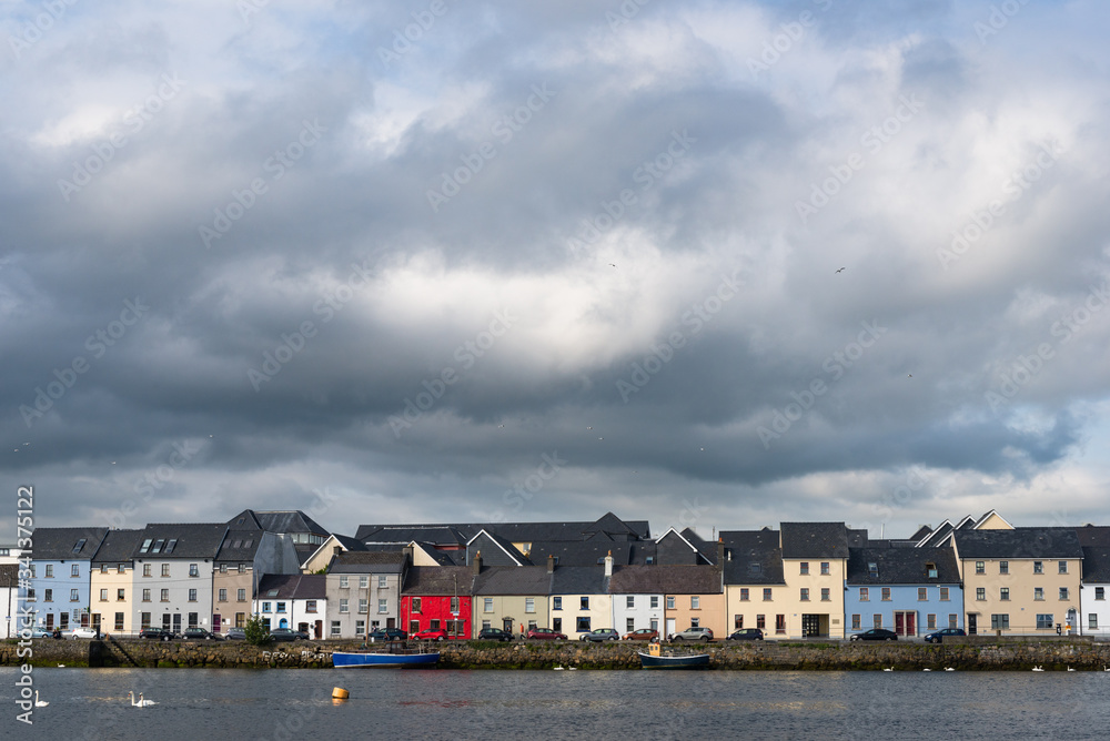 panoramic view of The Claddagh area of Galway city, cloudy dramatic skies.