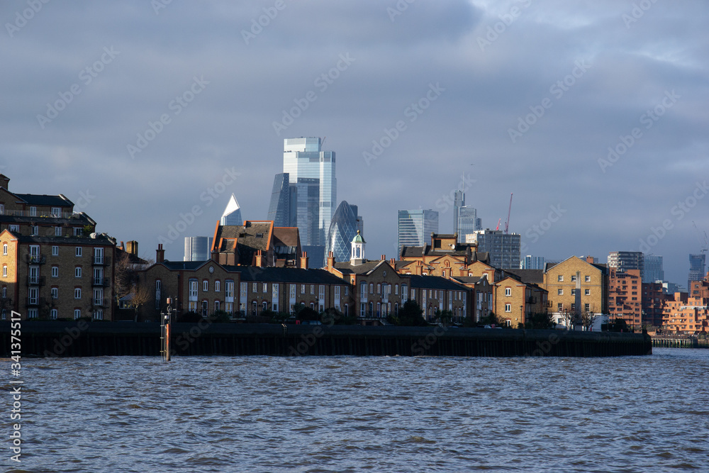 London, UK - December 27,2019 - London skyscrapers seen from the Thames.
