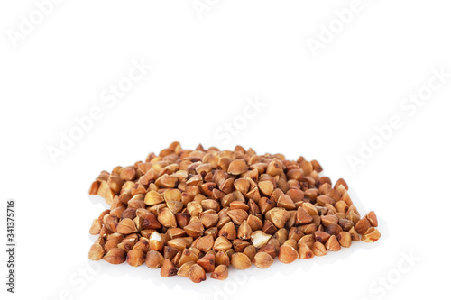 The buckwheat is scattered on a white background isolated.
