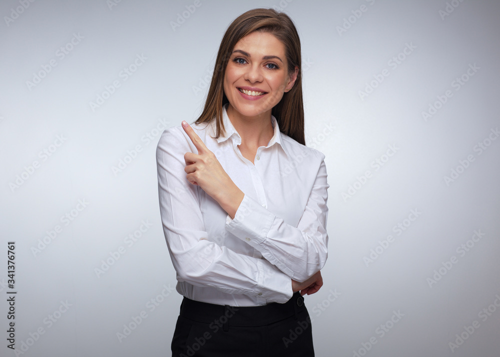 Young happy business woman pointing up with finger. Young happy business woman pointing up with finger.