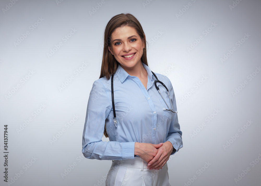 Smiling young woman doctor in blue shirt. Smiling young woman doctor in blue shirt.
