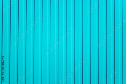 Turquoise background. Blue abstract corrugated metal wall