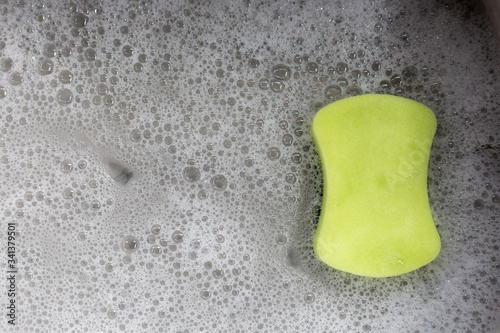 Sponge with bubbles in the sink.