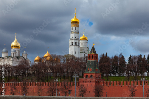 View of the Moscow Kremlin with a fortress wall and golden-domed churches