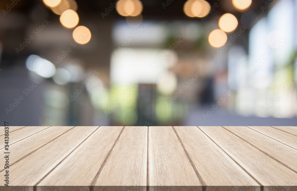 Empty wooden table top with lights bokeh on blur restaurant background, 3D Rendering