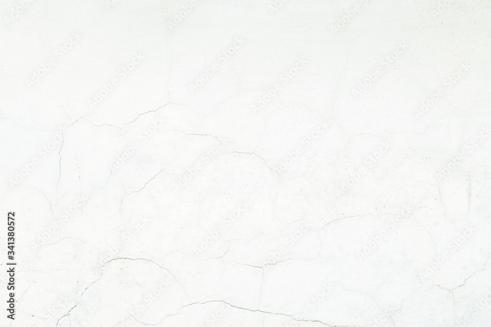 Obraz premium White cracked cement wall surface