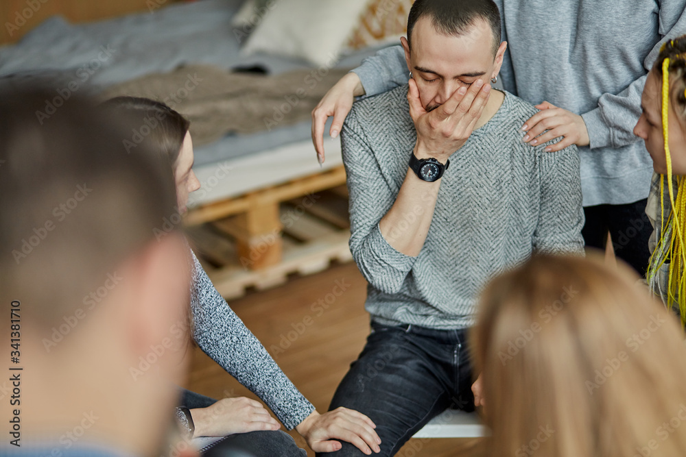 Obraz premium stressful caucasian male tired of life with alcoholism, handsome guy sit cry from hopelessness, ask for help and advice at meeting.