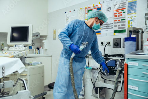 Doctor in emergency room of a hospital with respiratory equipment photo