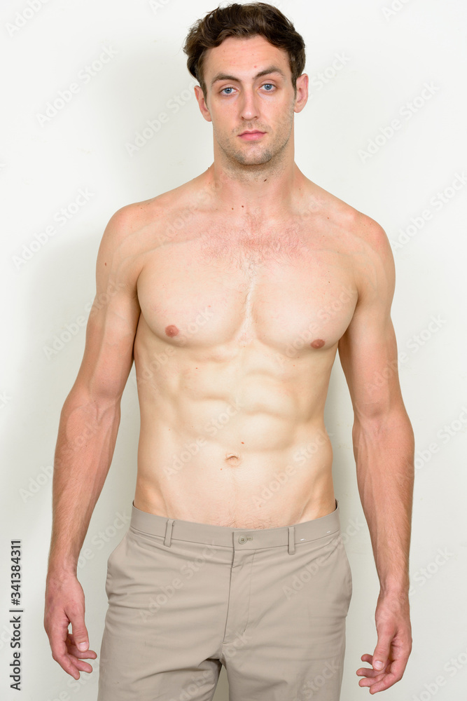 Fototapeta premium Portrait of young handsome muscular man shirtless