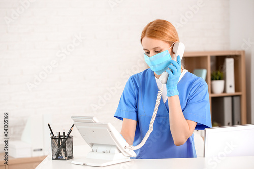Female receptionist working...