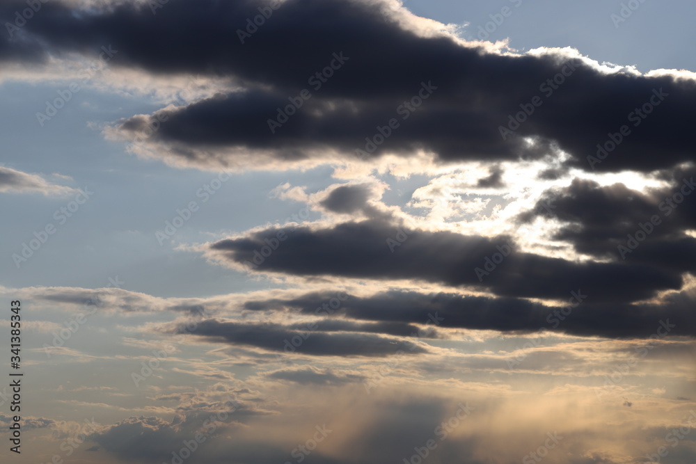The evening sky after the rain. Spring sky with clouds. The evening sky after the rain. Spring sky with clouds.