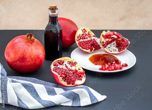 Pomegranate molasses or Narsharab sauce. Used in Middle Eastern, African and Mediterranean cooking, usually to add a sweet and sour note to dishes. photo