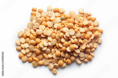 Dry yellow split peas isolated on white