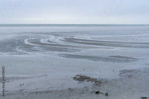 Germany, Schleswig-Holstein, Busum, Low tide at?Schleswig-Holstein Wadden Sea National Park photo