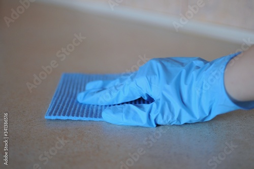 Woman disinfectanting most toching place and surfaces at home for prevent diseas