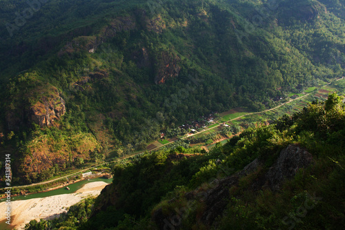 Beatiful view of the village in a valley between two hills from furit garden mangunan, Wonogiri, Yogyakarta-Indonesia