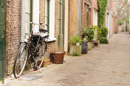 Bicycles parked on a quaint Dutch street in The Netherlands.