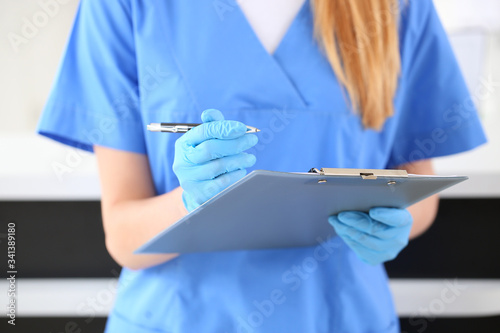 Female receptionist working in clinic, closeup