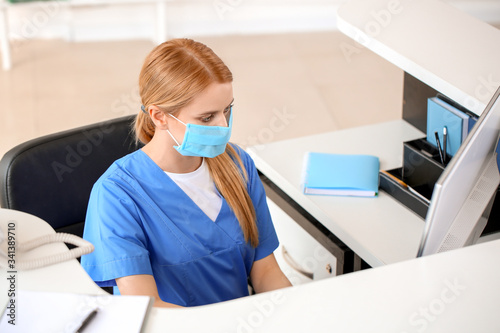 Female receptionist working...