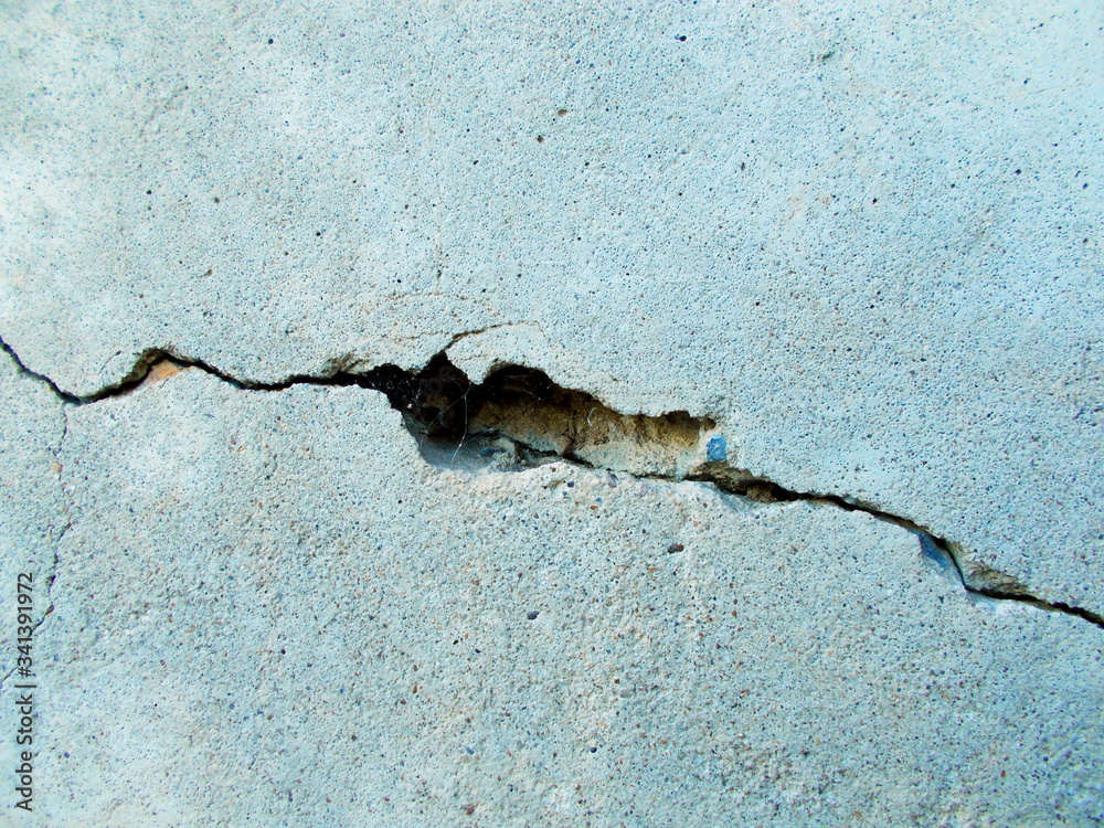 Crack in the wall of the building. Blurred defocused background for web design.
Crack in the wall of the building. Blurred defocused background for web design.