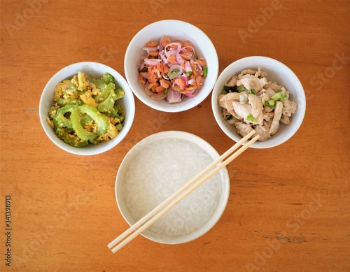 rice soup with fried vegetable ,shrimp salad and garlic chicken 