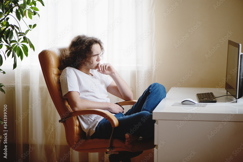 Teenager concentrated studying at home attending online classes. Teenager concentrated studying at home attending online classes.