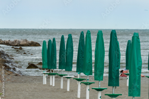 View of the umbrellas on the beach at Grado, Italy