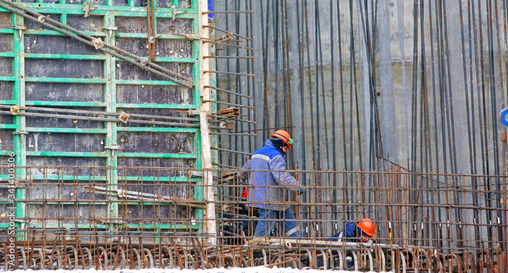 Fototapeta premium Worker male welder working at a construction site