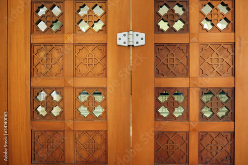 Islamic carved door in the mosque in Al Faruq Mosque, Sangatta, East Kalimantan, Indonesia.     photo