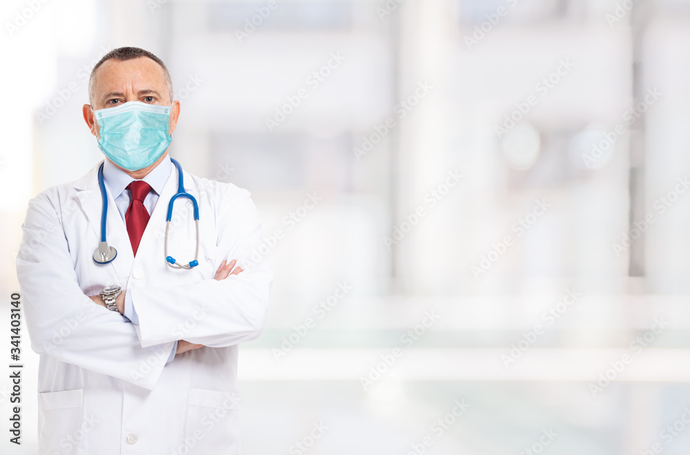Masked doctor in front of a bright background during coronavirus epidemic Masked doctor in front of a bright background during coronavirus epidemic