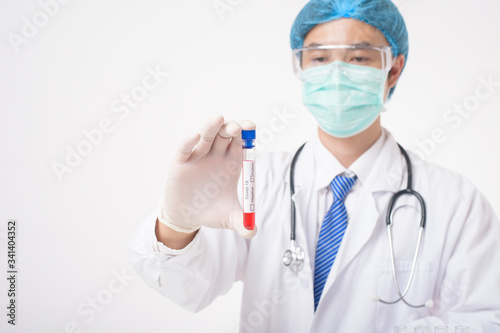 Doctor is holding infected  covid-19  blood test  on white Background © tonefotografia