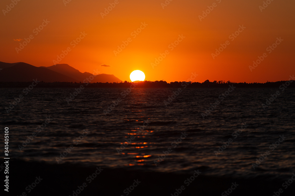 Sunset in Greece with the ocean in front