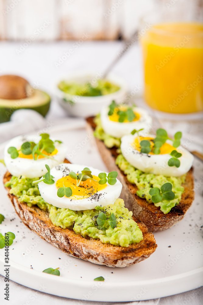 Avocado Sandwich with Egg and Micro green. Healthy breakfast concept