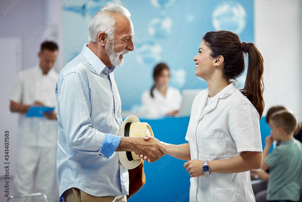 Happy senior man greeting with his female doctor at medical clinic. Happy senior man greeting with his female doctor at medical clinic.
