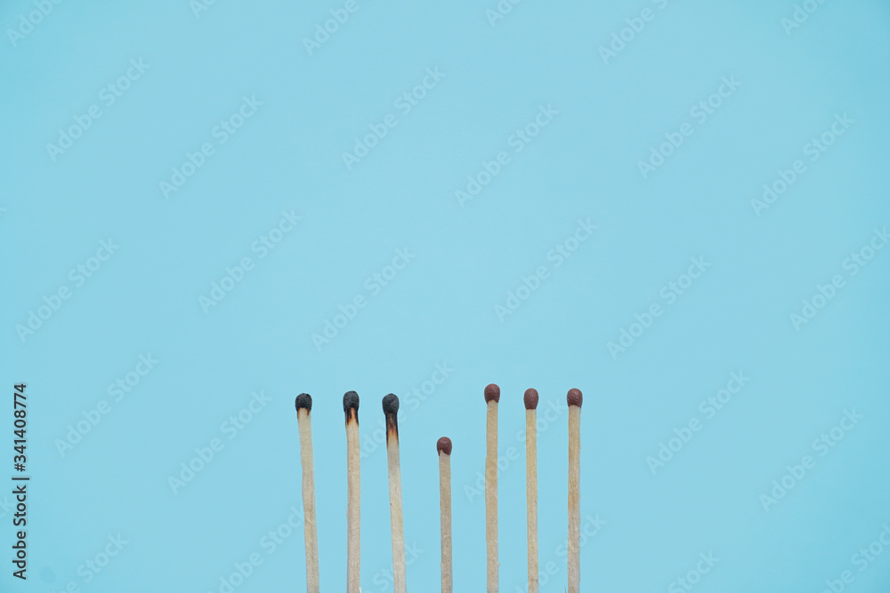 Maintain a distance between you and other people. Social distancing concept using burnt out match sticks as a metaphor for containing coronavirus or any virus or pandemic outbreak. Stay at home Maintain a distance between you and other people. Social distancing concept using burnt out match sticks as a metaphor for containing coronavirus or any virus or pandemic outbreak. Stay at home