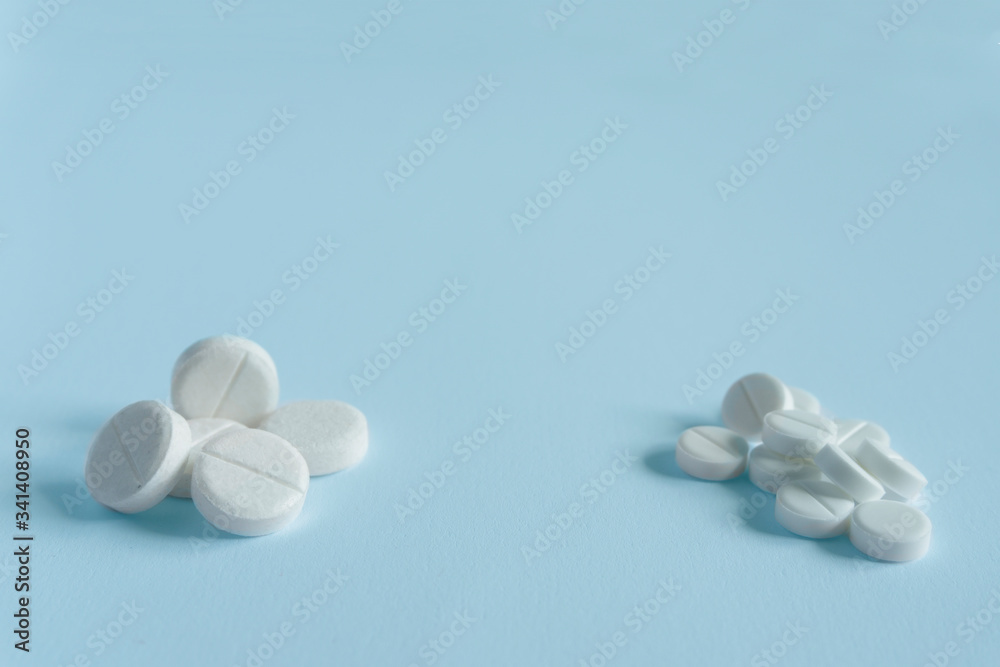 pile of pills on blue background with copy space. medicine concept pile of pills on blue background with copy space. medicine concept