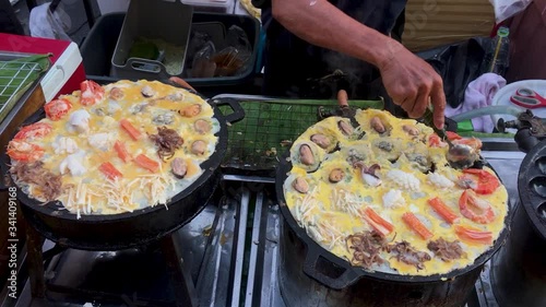 Famous Sunday Night Market in Phuket Town. Tourists walking and shopping in the old street.