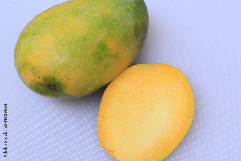 Fresh Yellow Mango fruit slice isolated on white background
Fresh Yellow Mango fruit slice isolated on white background