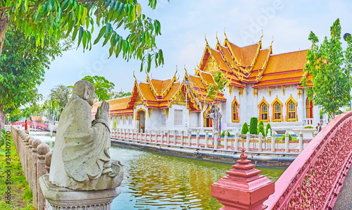 The monk's sculpture in park of Wat Benchamabophit Dusitvanaram Marble Temple, Bangkok, Thailand photo