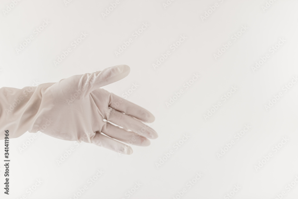 Female doctor's hand on a light background.