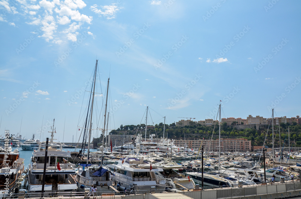 Luxury yachts and different boats docked at the pier at Port Hercules is the only deep-water port in Monaco. Travel and tourism concept